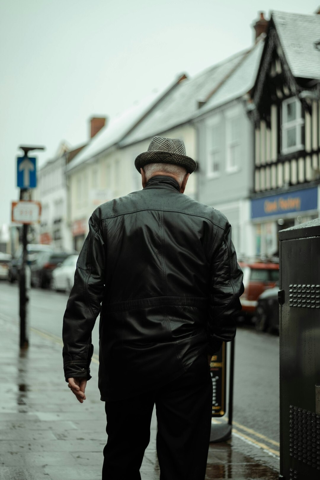 detective walking in rain
