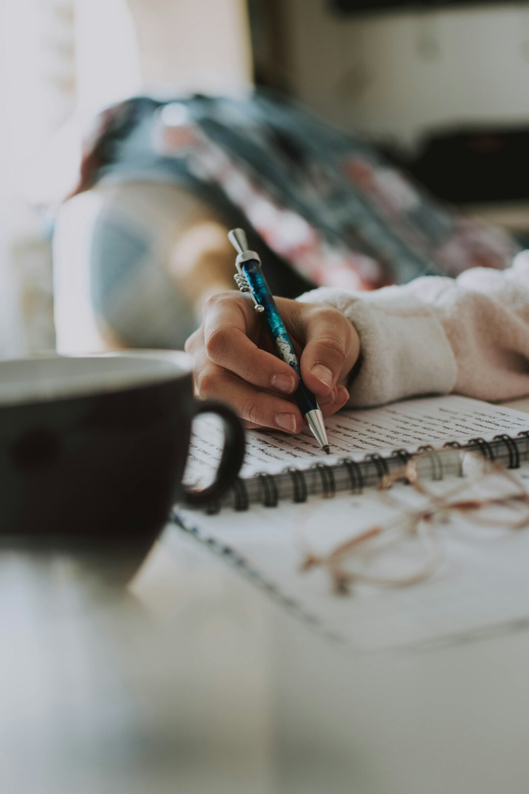 writer at desk with notes