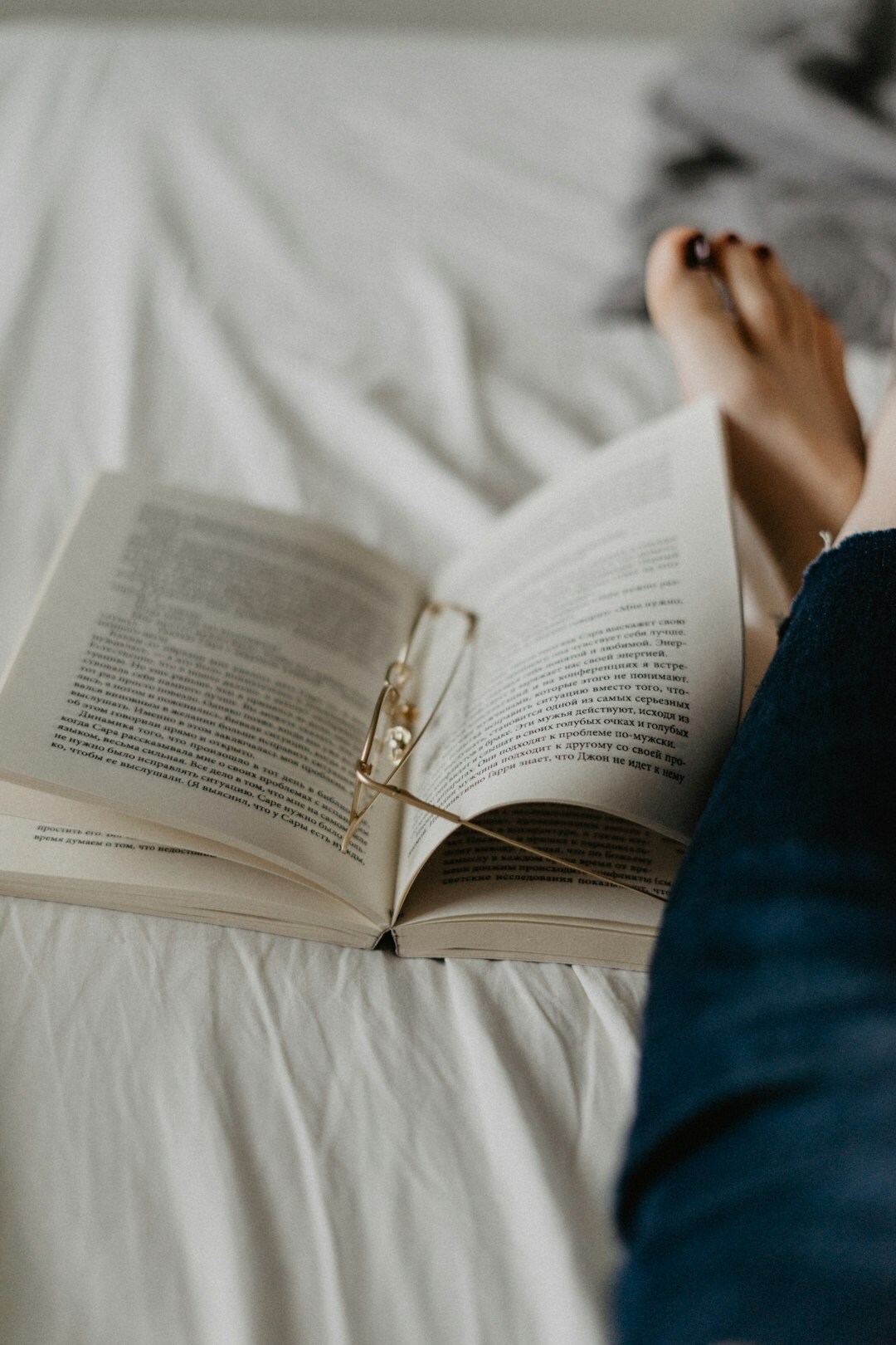 person reading book at home